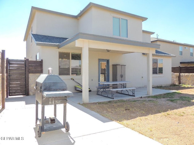 back of house with a patio area