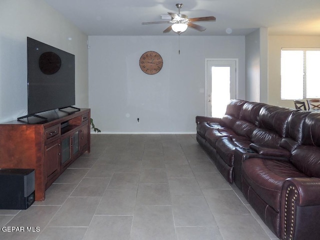 tiled living room featuring ceiling fan