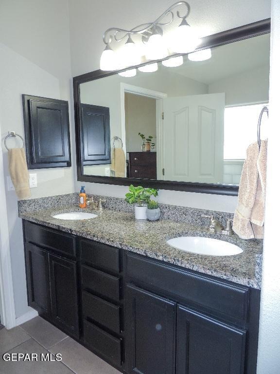 bathroom featuring vanity and tile patterned flooring