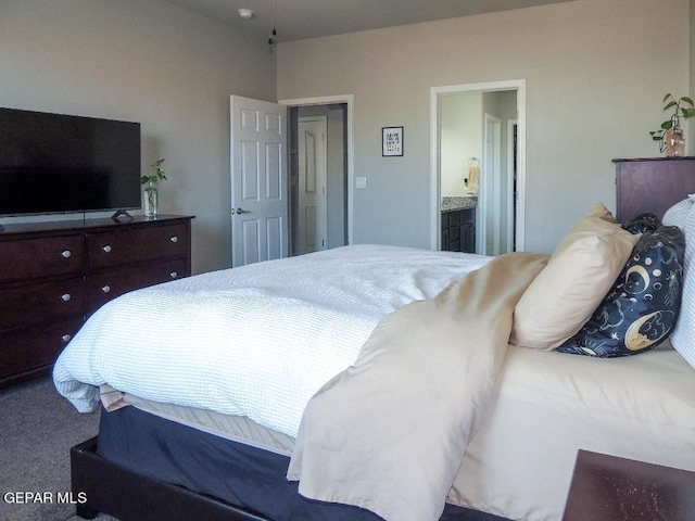 bedroom with carpet floors and ensuite bath