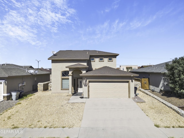 14241 Craggy Rock Ave, El Paso, TX 79938 - prairie-style house featuring stucco siding, driveway, and an attached garage