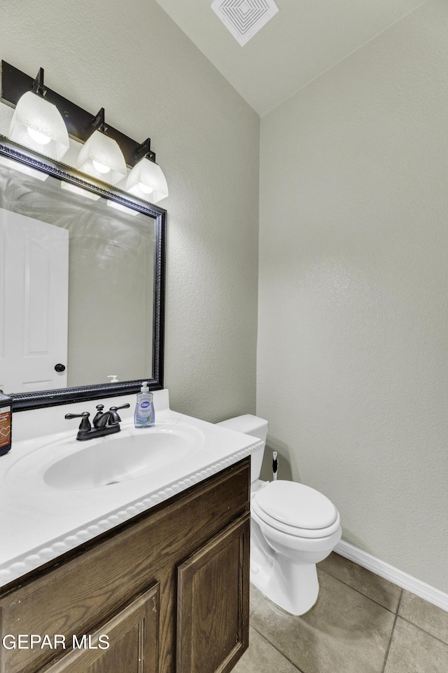 14241 Craggy Rock Ave, El Paso, TX 79938 - half bathroom with vanity, tile patterned floors, toilet, visible vents, and baseboards