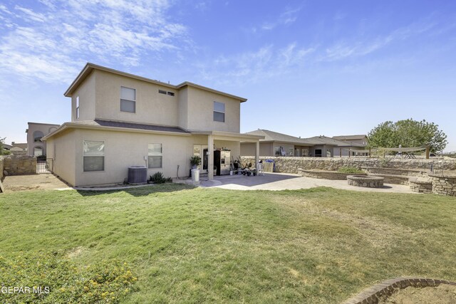 14241 Craggy Rock Ave, El Paso, TX 79938 - back of property with a fire pit, fence, a patio area, central air condition unit, and stucco siding