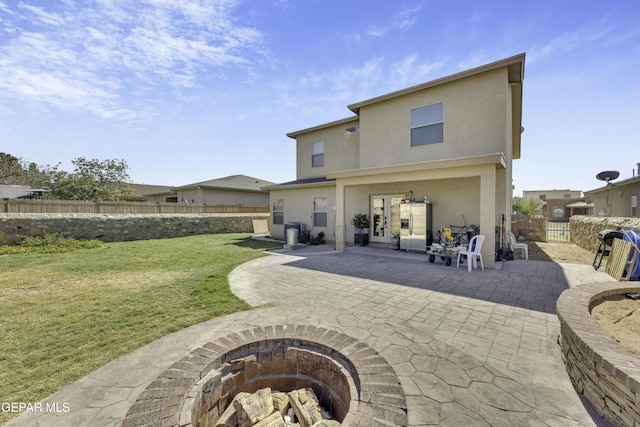 14241 Craggy Rock Ave, El Paso, TX 79938 - back of house featuring a patio, stucco siding, a yard, french doors, and a fenced backyard