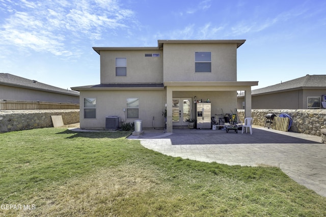 14241 Craggy Rock Ave, El Paso, TX 79938 - rear view of property featuring cooling unit, a patio, stucco siding, a yard, and french doors