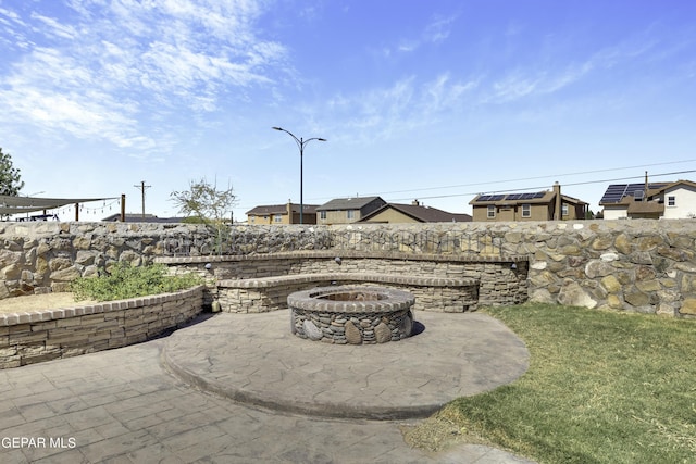 14241 Craggy Rock Ave, El Paso, TX 79938 - view of patio / terrace with a fire pit