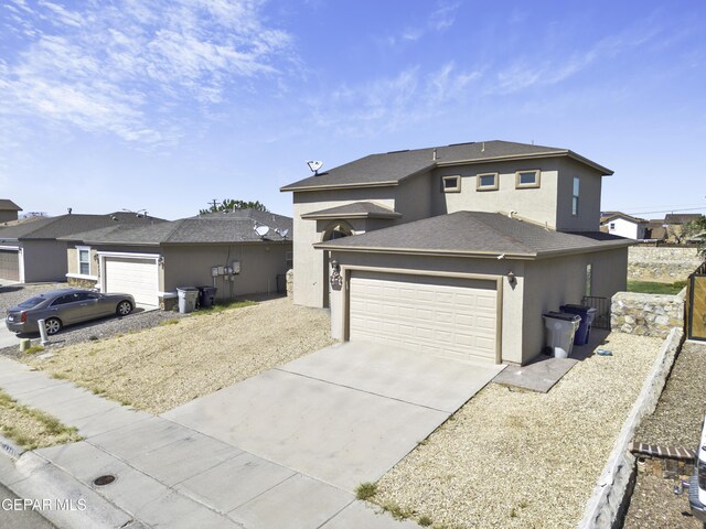 14241 Craggy Rock Ave, El Paso, TX 79938 - view of front of property with an attached garage, concrete driveway, and stucco siding