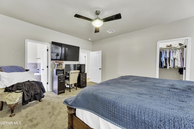 14241 Craggy Rock Ave, El Paso, TX 79938 - bedroom featuring light colored carpet, visible vents, a ceiling fan, ensuite bath, and a walk in closet
