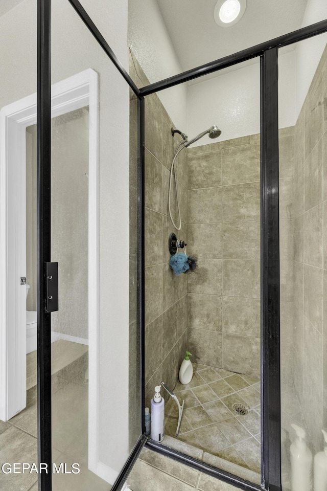 14241 Craggy Rock Ave, El Paso, TX 79938 - bathroom with toilet and a shower stall