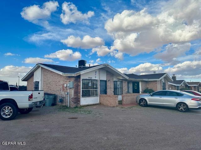 ranch-style house featuring central air condition unit