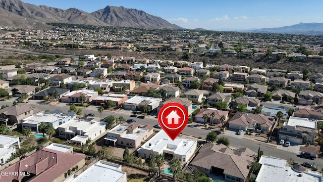 birds eye view of property featuring a mountain view