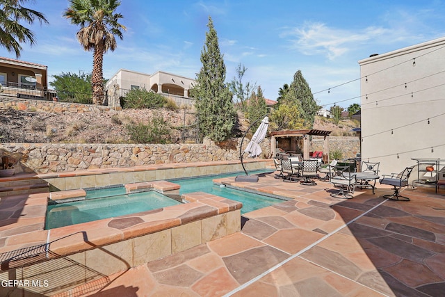 view of swimming pool featuring an in ground hot tub, a patio, and a pergola