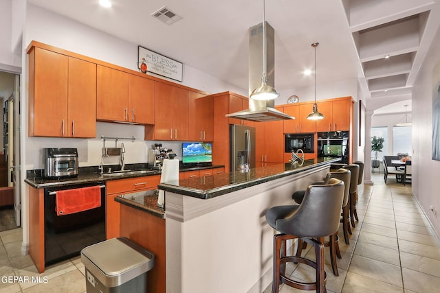 kitchen with black appliances, a center island, sink, pendant lighting, and light tile patterned floors