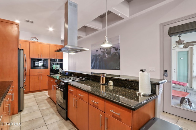 kitchen featuring ceiling fan, dark stone countertops, decorative light fixtures, black appliances, and island range hood