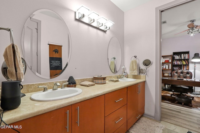 bathroom featuring hardwood / wood-style floors, vanity, and ceiling fan