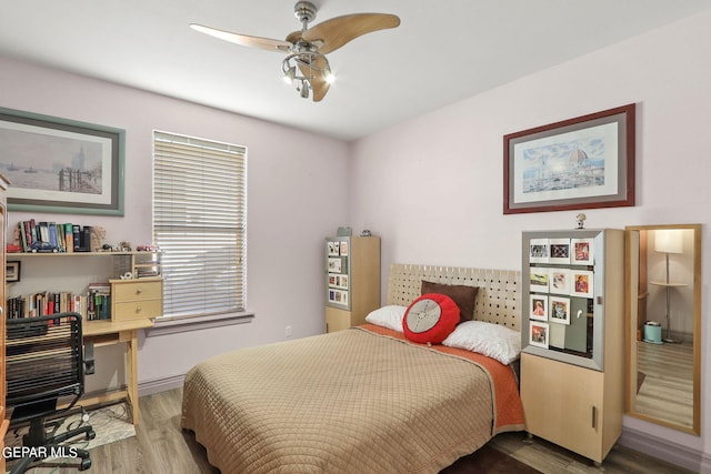 bedroom featuring ceiling fan and hardwood / wood-style flooring