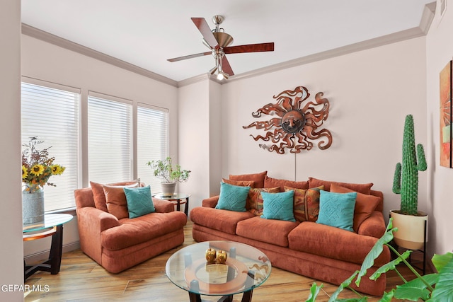 living room featuring light hardwood / wood-style floors, crown molding, and ceiling fan