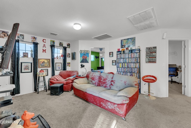 living room with light carpet and a textured ceiling