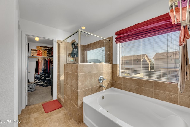 bathroom with tile patterned flooring and plus walk in shower