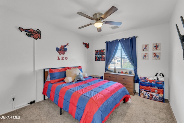 bedroom featuring light carpet and ceiling fan