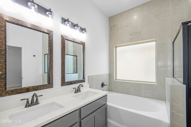 bathroom with vanity and a bathing tub