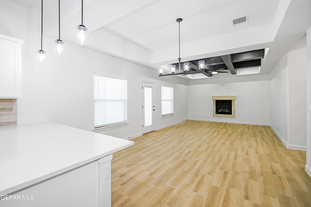 unfurnished living room with light hardwood / wood-style flooring