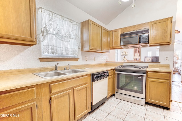 kitchen with plenty of natural light, stainless steel stove, sink, and white dishwasher