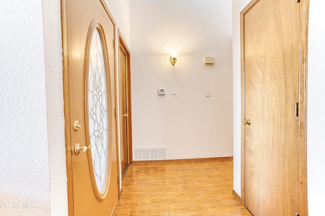 hall featuring light wood-type flooring