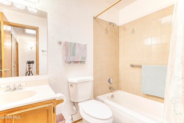 full bathroom with shower / bathtub combination with curtain, vanity, and toilet