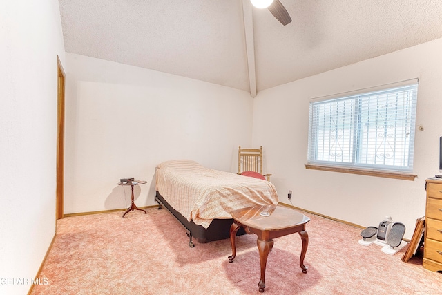 bedroom with light colored carpet, vaulted ceiling with beams, a textured ceiling, and ceiling fan