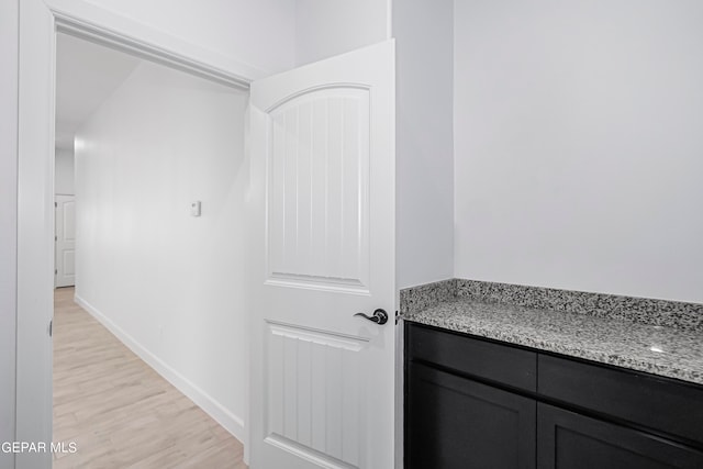 bathroom with hardwood / wood-style floors and vanity