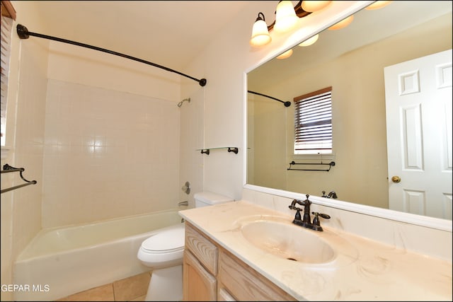 full bathroom with tiled shower / bath combo, tile patterned floors, vanity, and toilet