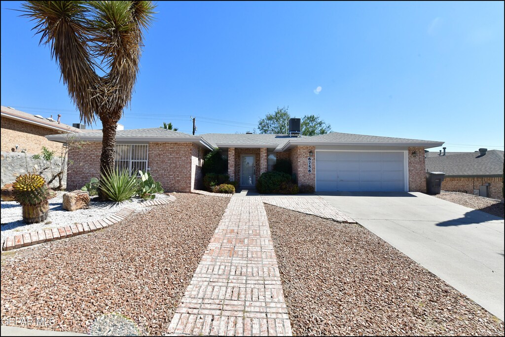 single story home with a garage