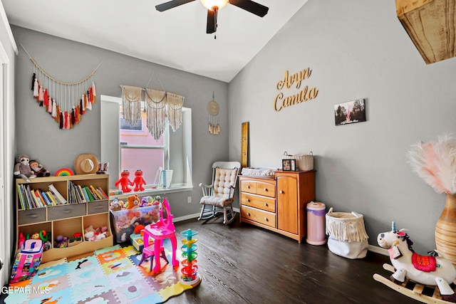 playroom with lofted ceiling, ceiling fan, and dark hardwood / wood-style flooring