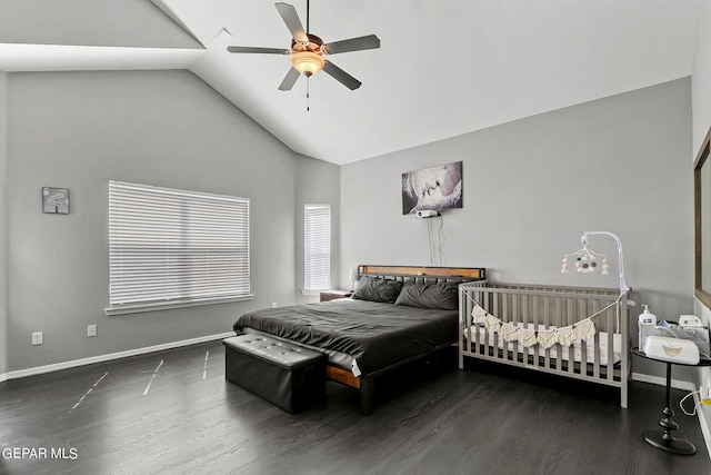 bedroom featuring ceiling fan, dark hardwood / wood-style floors, and high vaulted ceiling