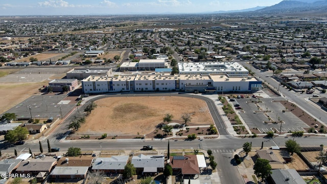 birds eye view of property featuring a mountain view