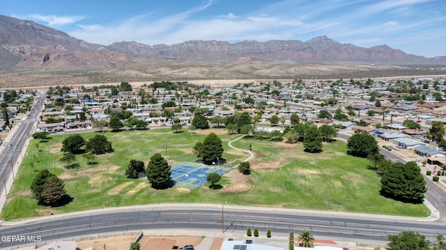 birds eye view of property with a mountain view and a residential view