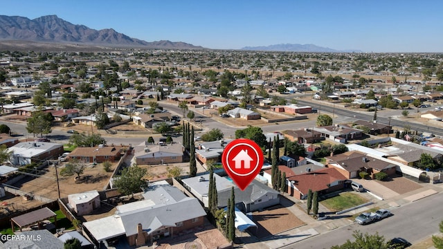 birds eye view of property with a residential view and a mountain view