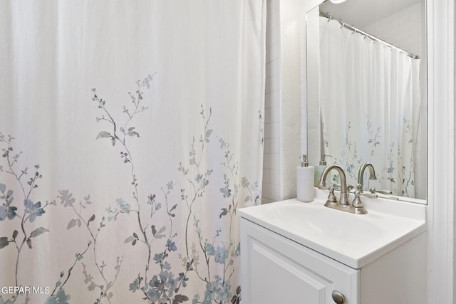 full bath with vanity and a shower with curtain