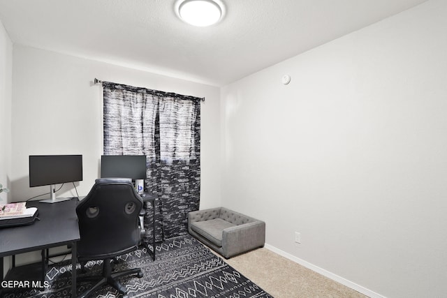 carpeted office with baseboards