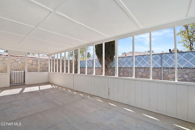 unfurnished sunroom with a wealth of natural light
