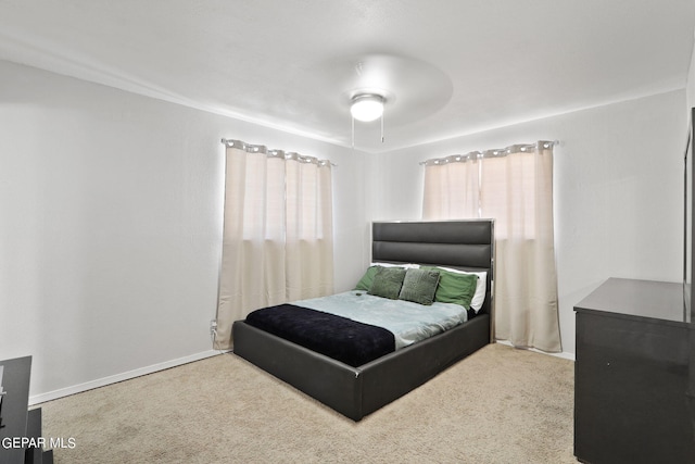bedroom with carpet and baseboards