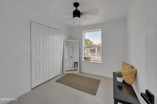 interior space featuring ceiling fan