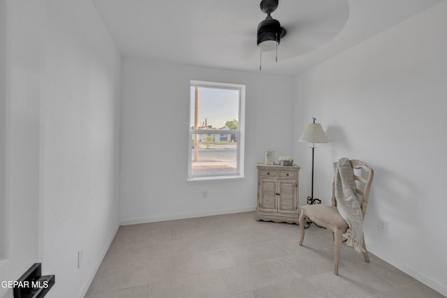 sitting room with ceiling fan and light tile patterned floors