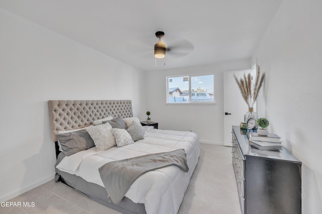 bedroom featuring light tile patterned flooring and ceiling fan