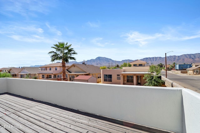 wooden terrace featuring a mountain view