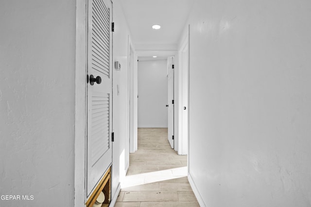 corridor with light wood-type flooring