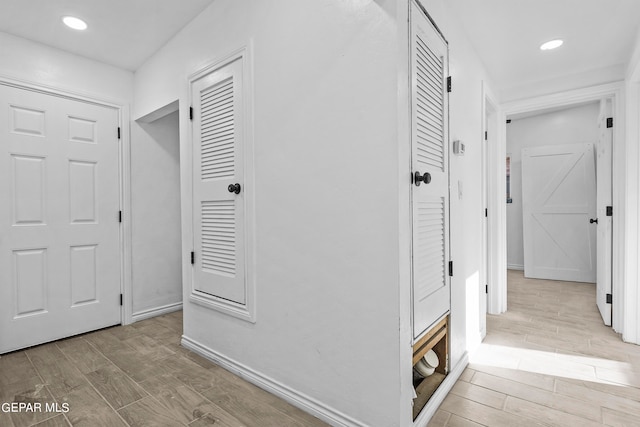 corridor featuring light hardwood / wood-style floors