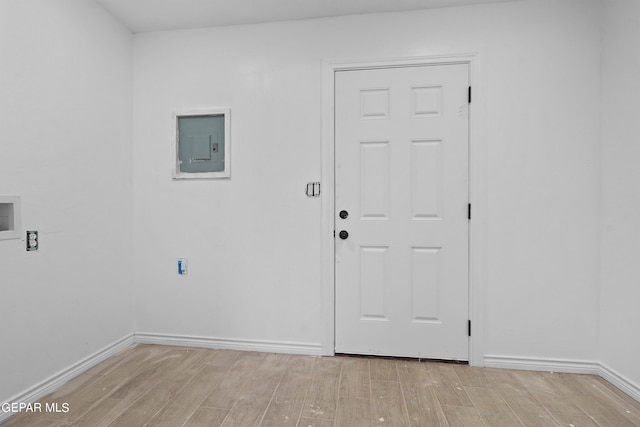 interior space with electric panel and light wood-type flooring