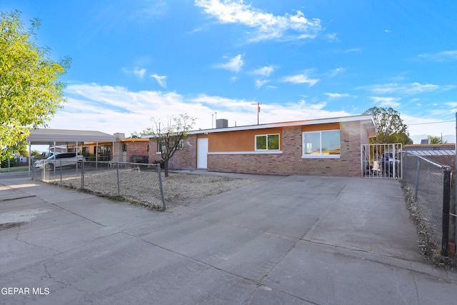 single story home featuring a carport